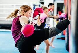 group of people doing kickboxing