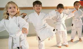 group of kida doing karate
